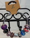 Stainless steel wrap bracelet with purse charm