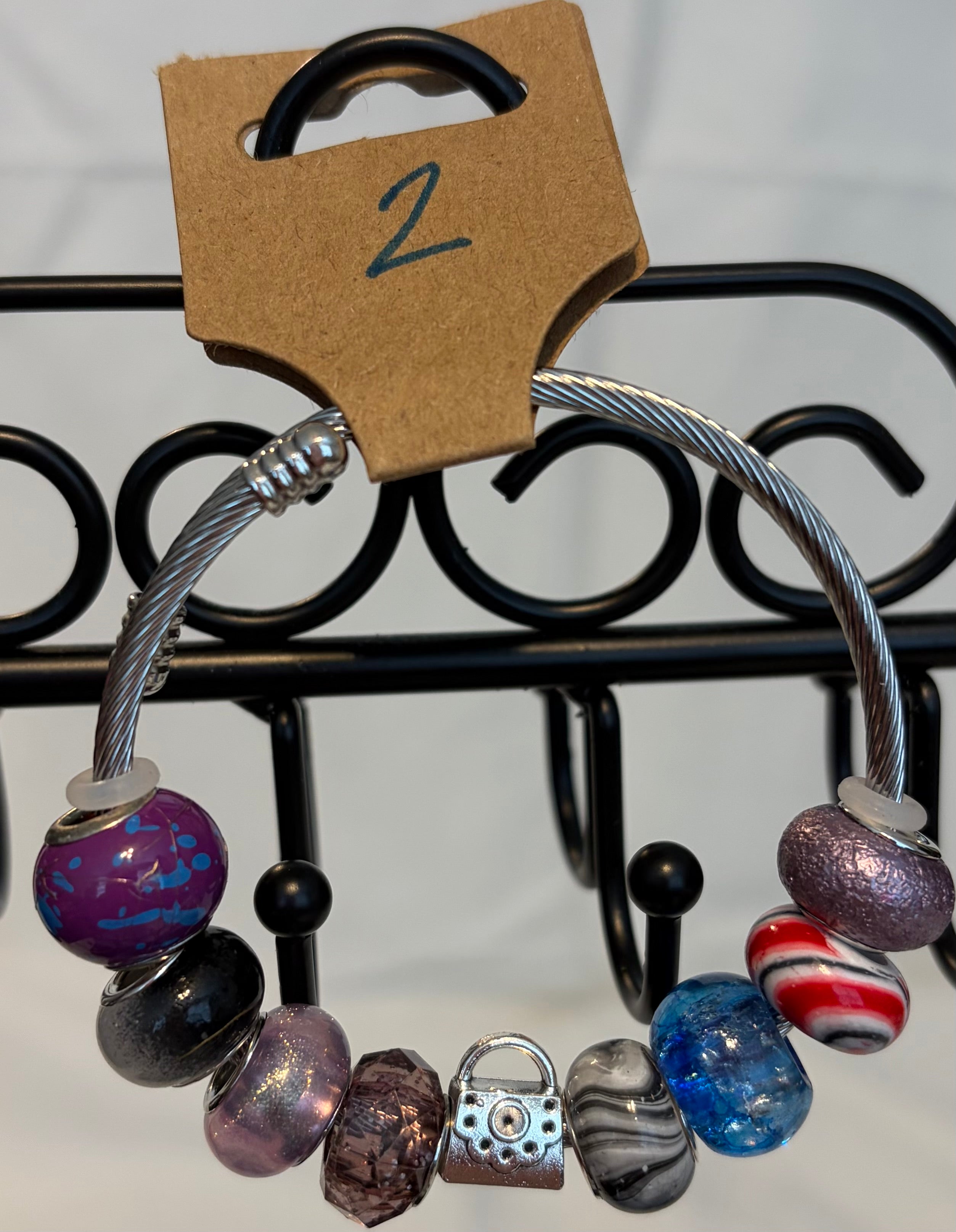 Stainless steel wrap bracelet with purse charm