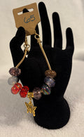 Gold toned adjustable bracelet butterfly charm