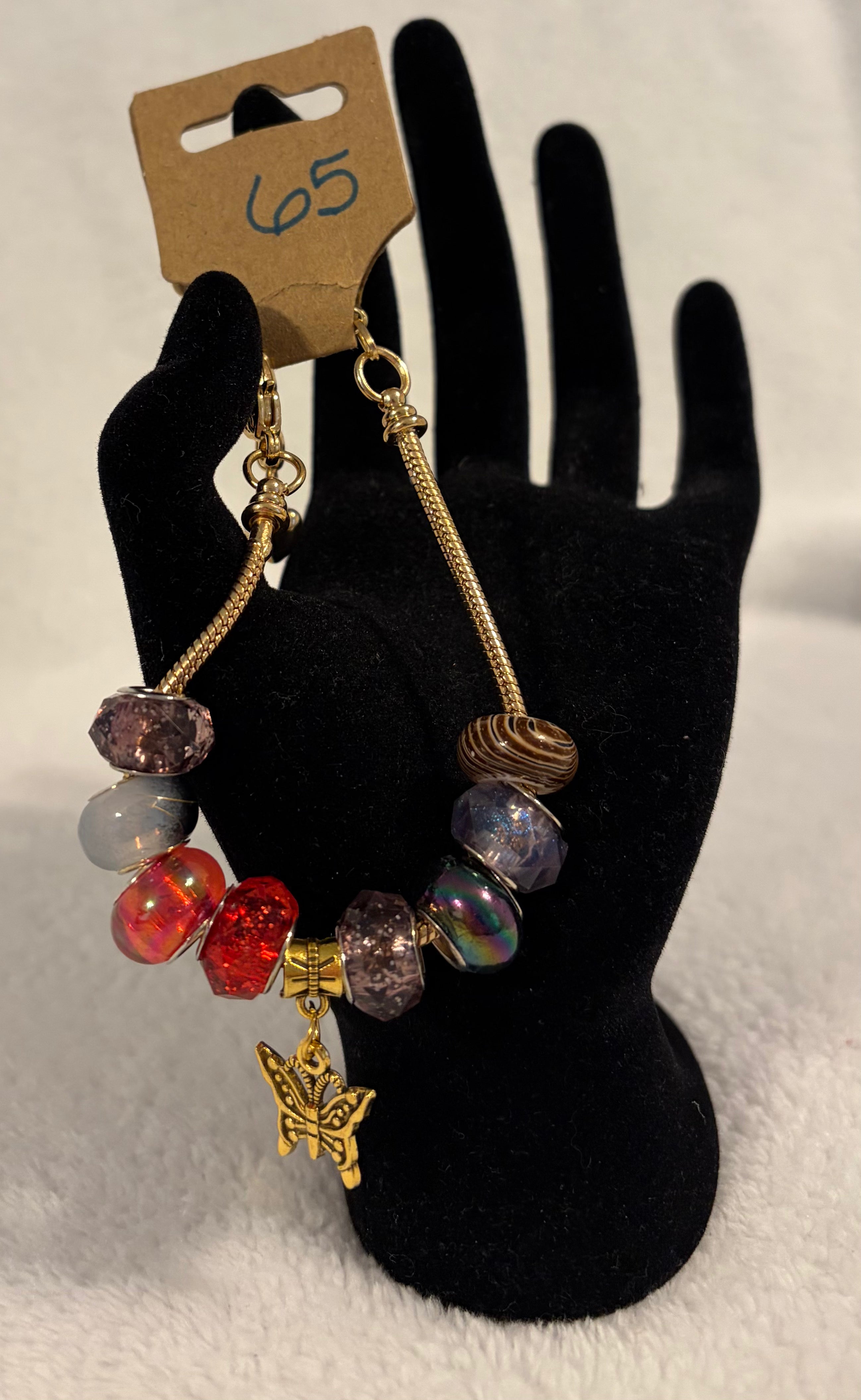 Gold toned adjustable bracelet butterfly charm