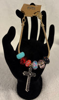 Gold toned adjustable bracelet with cross charm